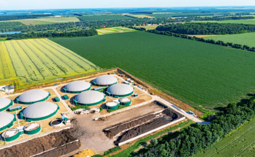 Biogas storage tanks surrounded by fields