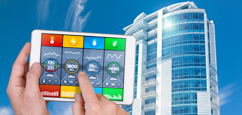 Featured Image. Tablet display showing performance of building energy systems for heating, power, light, and water, with a highrise building in the background.