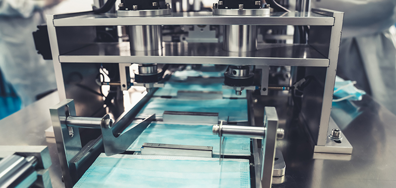 L'image sélectionnée. Face mask production line in modern factory