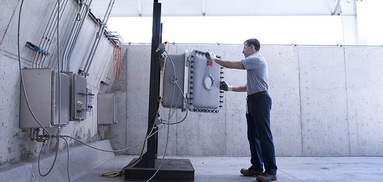 Featured Image. An engineer performs tests in a hazardous location testing lab.