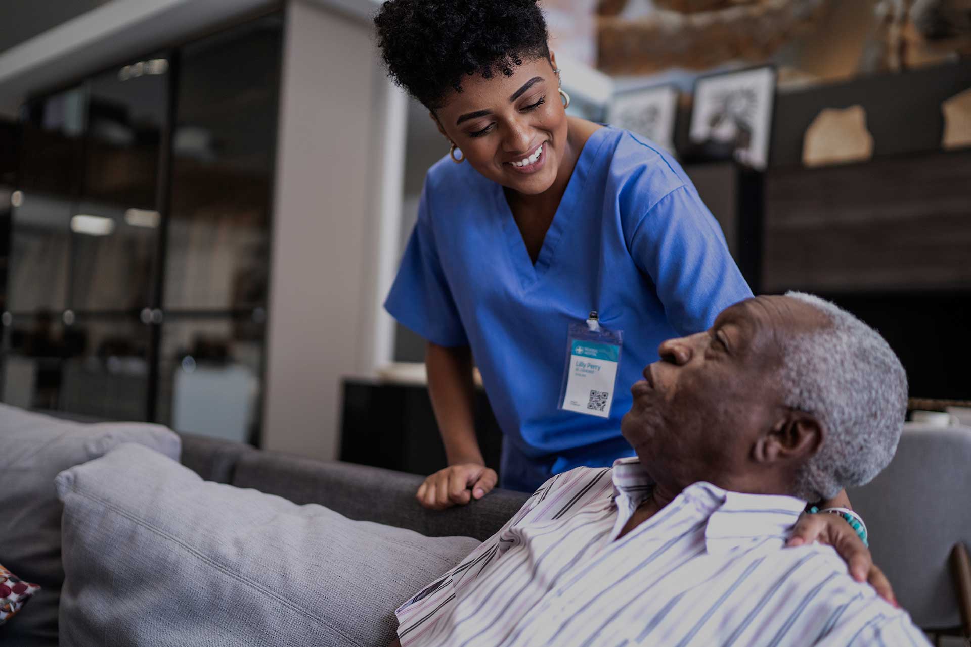 A female nurse interacting with a long-term care home resident