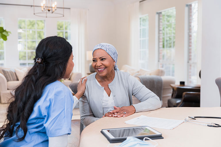 A person with a chronic illness talking with a health care professional